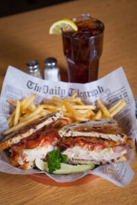 Club sandwich with fries and an ice T from A-Pine Restaurant in Pequot Lakes, MN