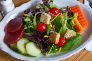 Salad with greens, tomatoes, cucumber, beets and carrots from A Pine Restaurant in Pequot Lakes, MN